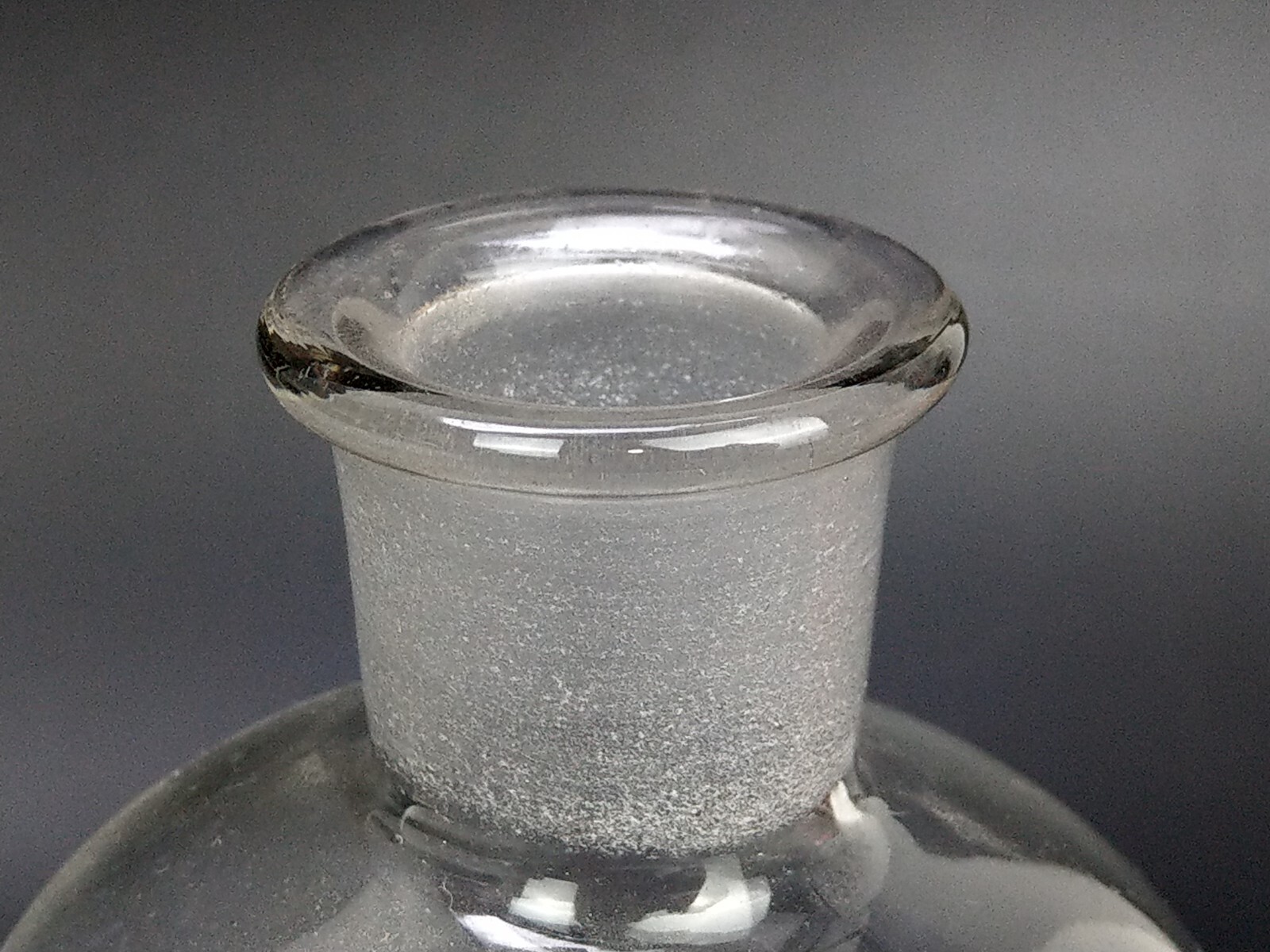 Antique chemist clear bottle with flat stopper This clear glass bottle from the